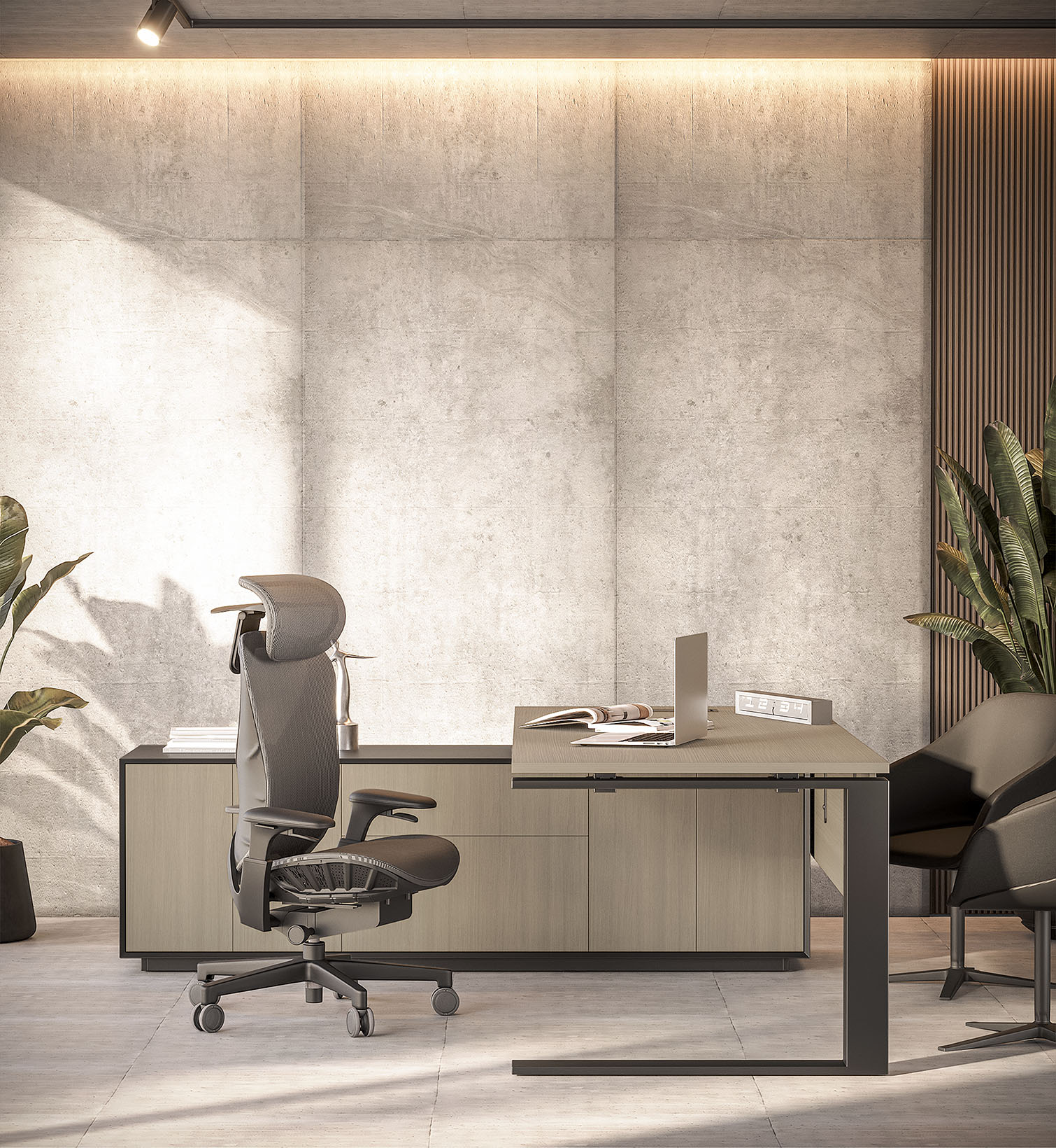 Modern, executive home office featuring a ergonomic chair with a high back and headrest positioned in front of a light wood and dark contrast desk setup against a textured concrete accent wall with subtle backlighting. A laptop sits on the desk, and large potted plants frame the scene, suggesting a contemporary and comfortable workspace.