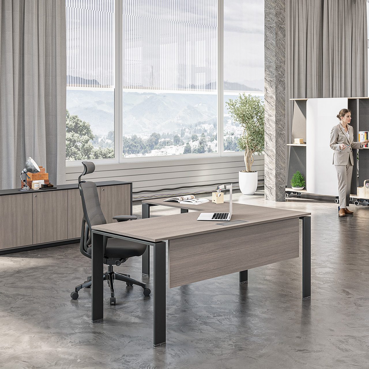 Modern executive Office Desk with black metal frame, grey high-back ergonomic chair, and wood credenza storage.